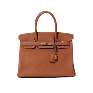 Birkin. Authentic quality luxury bag crafted in genuine leather comes with authenticity card, dust bag and gift bag. Exquisite Craftsmanship and Timeless Elegance: Discover the Allure of the Birkin Bag Large Leather Top Handle. Designed with the actress Jane Birkin in mind, the Birkin bag is a contemporary development of the Kelly bag. Created based on Jane’s suggestions, it was architected to be more significant to fit modern women’s fast-paced life, with several minor yet outstanding adaptations, such as the elongated top handles. The French Birkin 30 bag is a classic touch of elegance to your look! The accessory features a trapeze body, a pebbled leather texture, a hanging key fob, gold-tone hardware, round top handles, a padlock fastening detail, a foldover top with twist-lock closure, a front center logo stamp, an internal zipped pocket, and purse feet.
